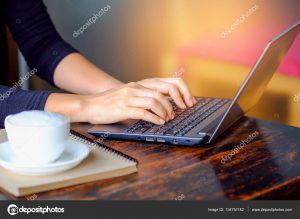 Business people working laptop with coffee on table.